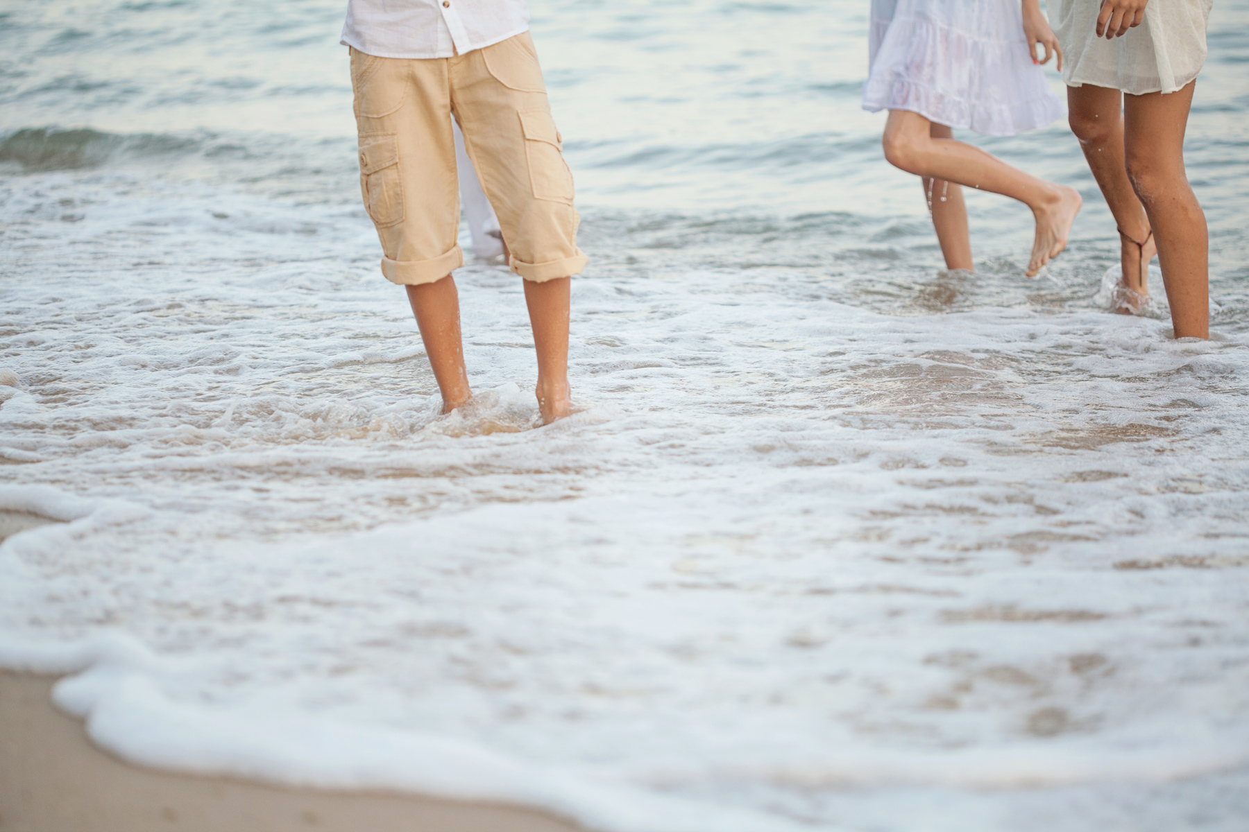 Children playing in the waves